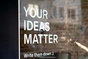A sign that says "Your Ideas Matter. Write them down"